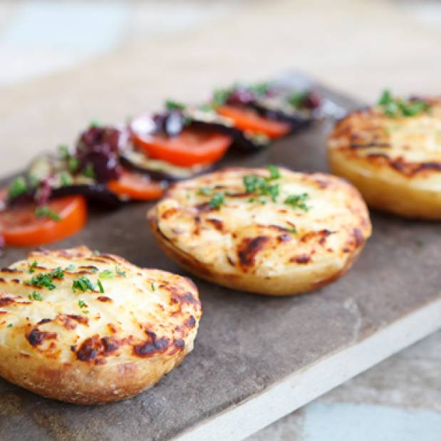 Cheesy potatoes with black olive, tomato & aubergine salad